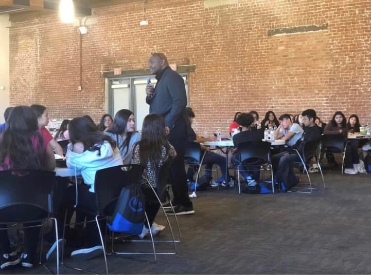 Eric Swann speaking to student-athletes at an Aguila Leadership session.
