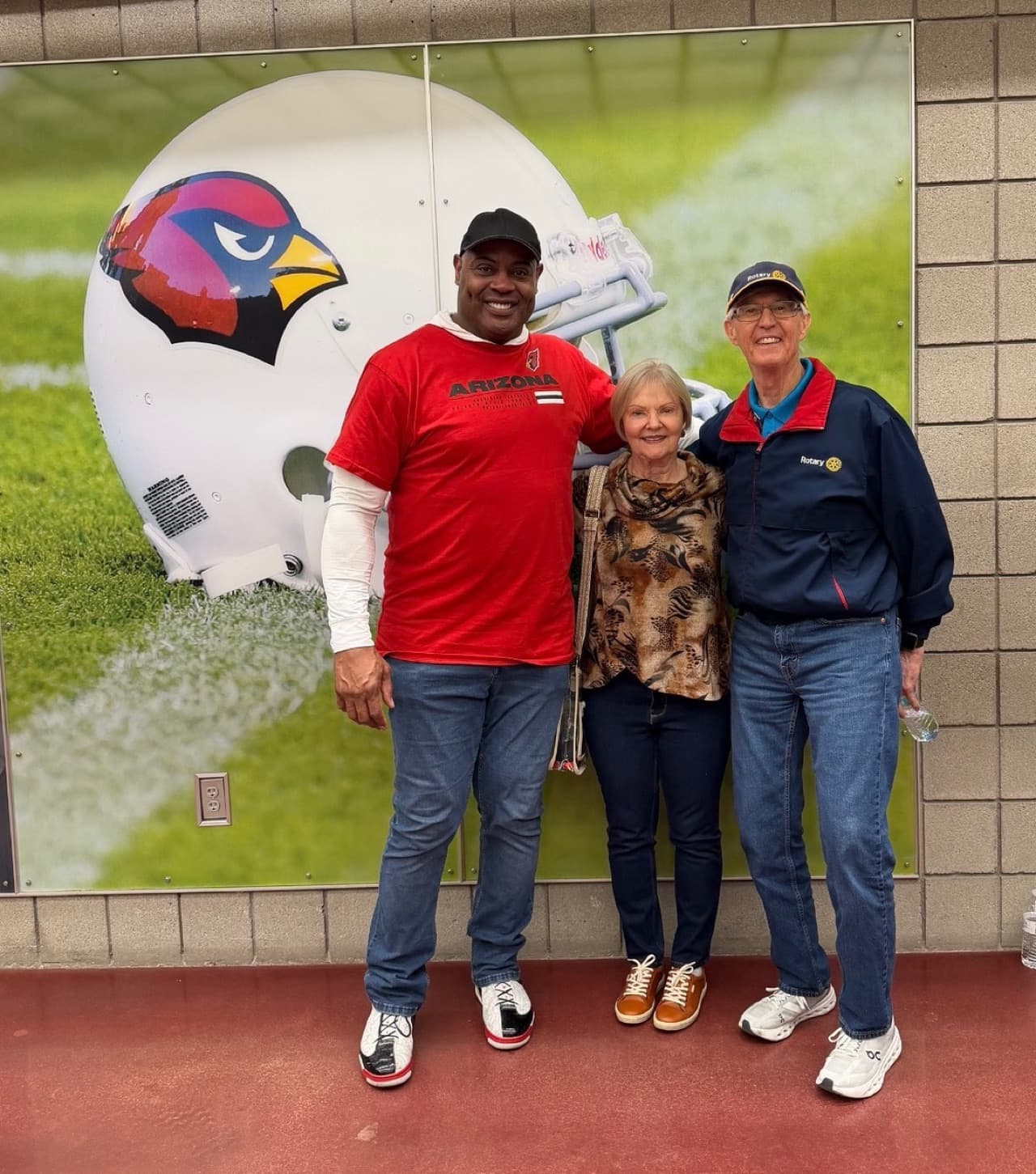 Eric Swann at a personal appearance event in front of an Arizona Cardinals helmet display.